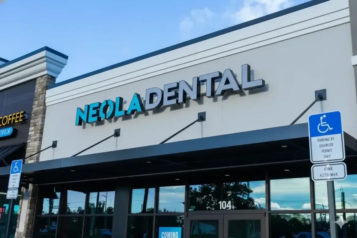 Dentist examining a patient in a treatment room at Neola Dental in Minneola, FL