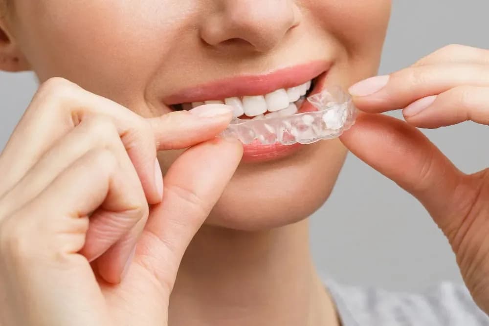 Neola Dental Family Putting on Invisalign Aligners