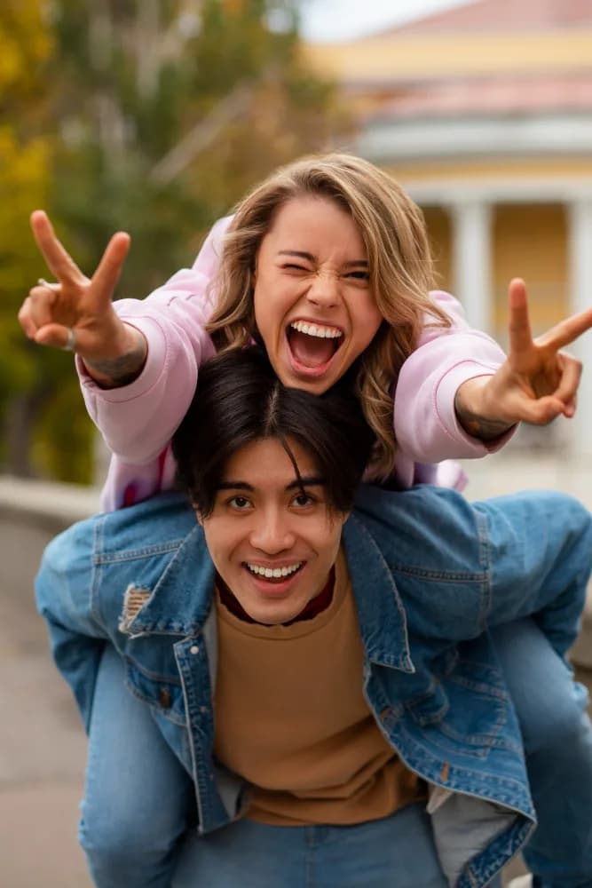 Happy young couple with healthy, bright smiles after their visit at Neola Dental, serving Montverde, FL from Minneola